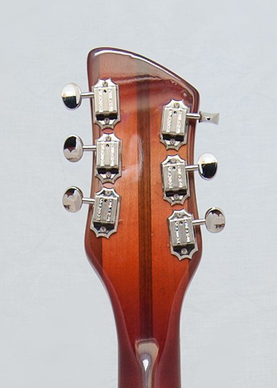 A close up of the headstock of a guitar