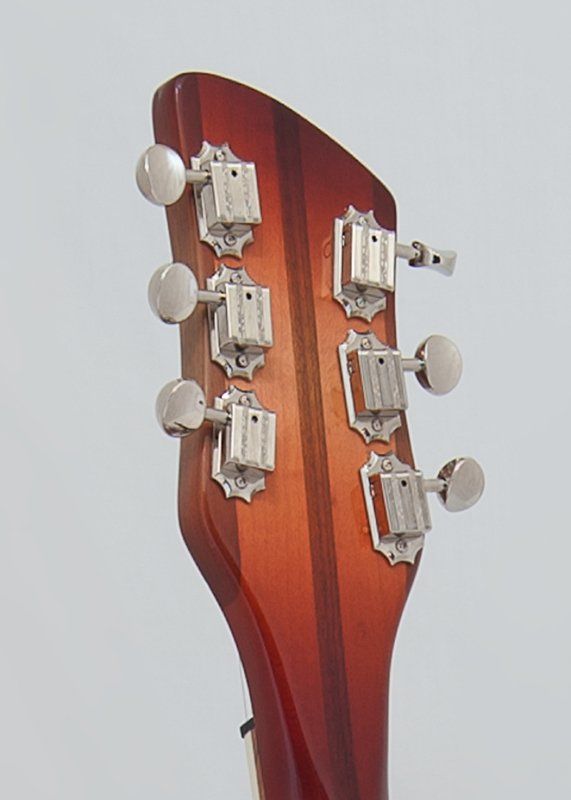 A close up of the headstock of a guitar