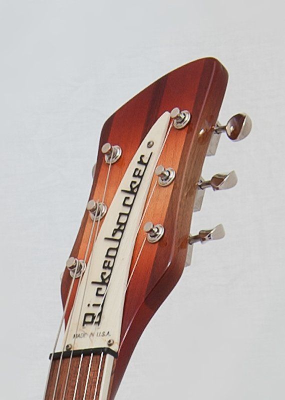 A close up of the headstock of a rickenbacker guitar