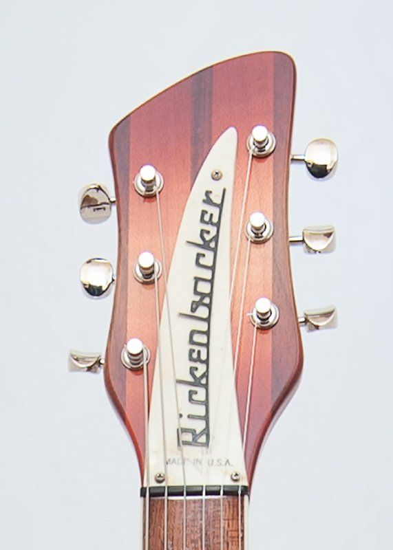 A close up of a rickenbacker guitar headstock