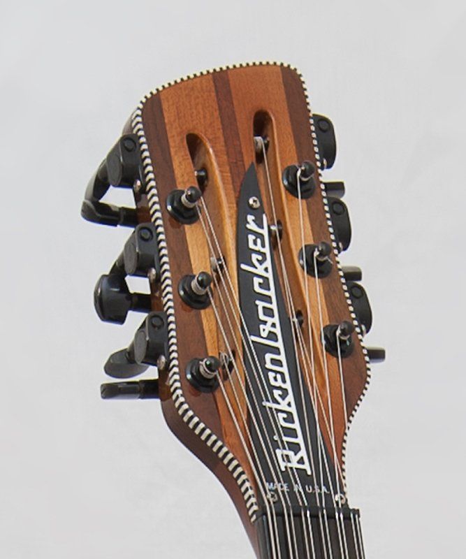 A close up of a rickenbacker guitar headstock
