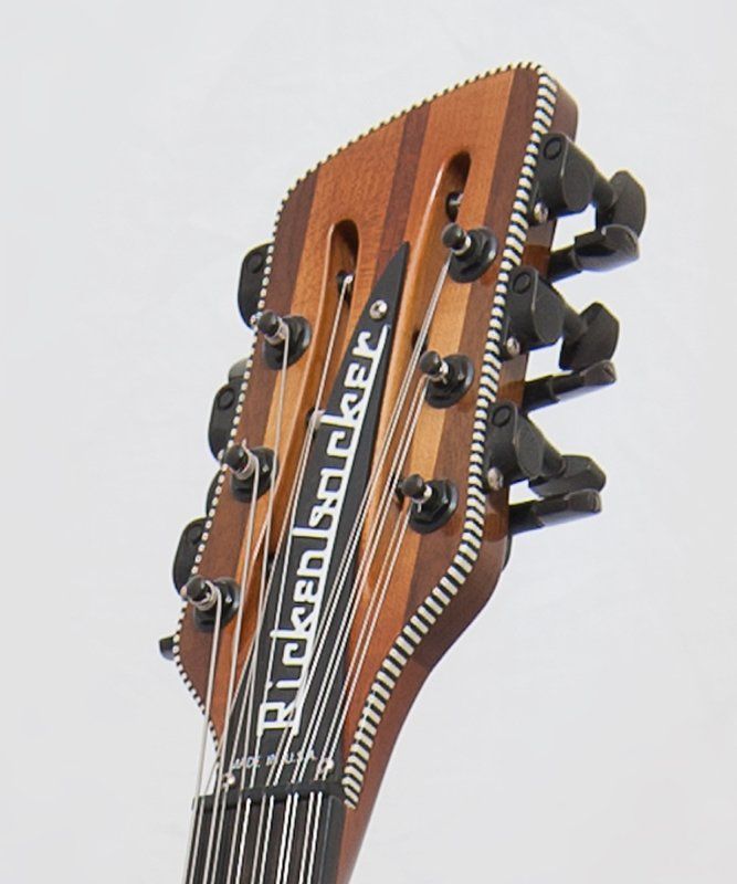 A close up of a rickenbacker guitar headstock