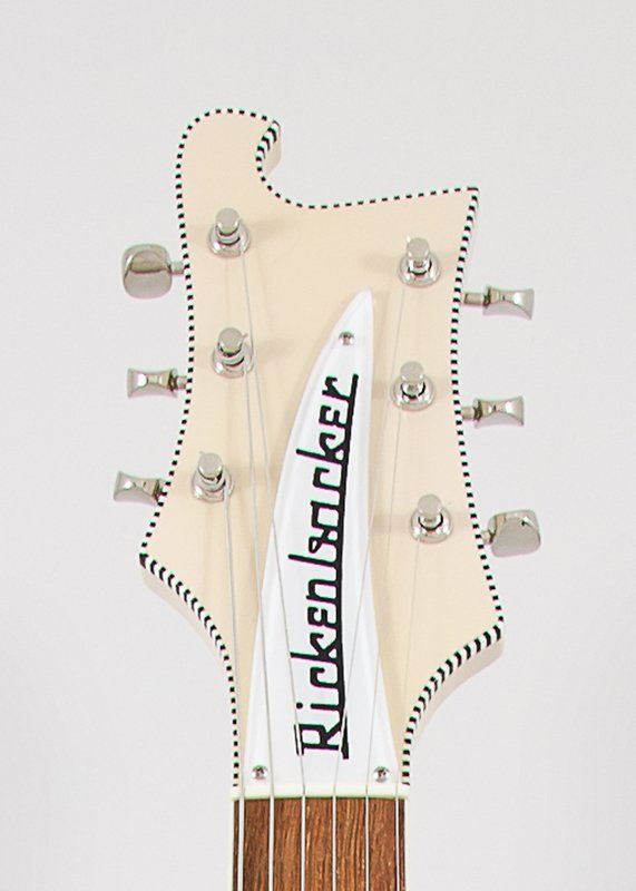 A close up of the headstock of a rickenbacker electric guitar