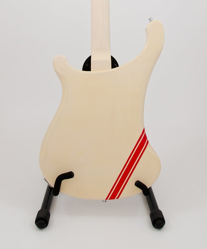 A white guitar with a red stripe on the back