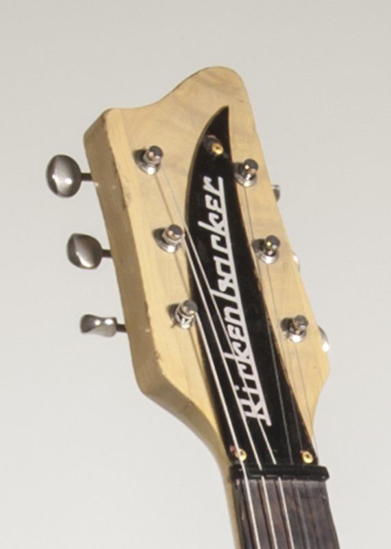 The headstock of a rickenbacker electric guitar