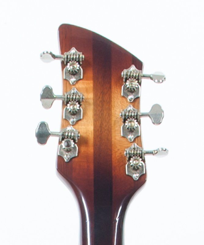 A close up of a guitar headstock on a white background
