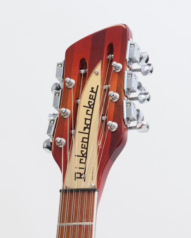 A close up of a rickenbacker guitar headstock