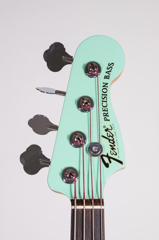 The headstock of a fender precision bass guitar