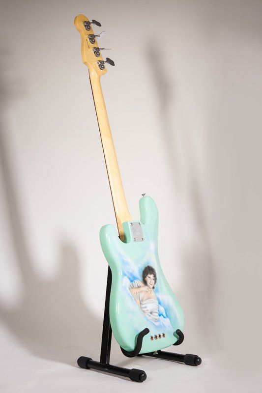 A guitar with a picture of a woman on it