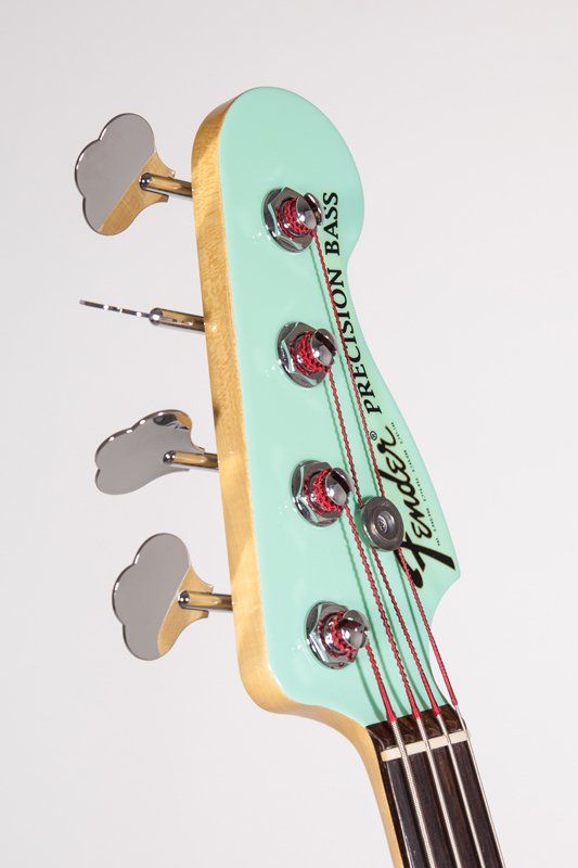 The headstock of a fender precision bass guitar