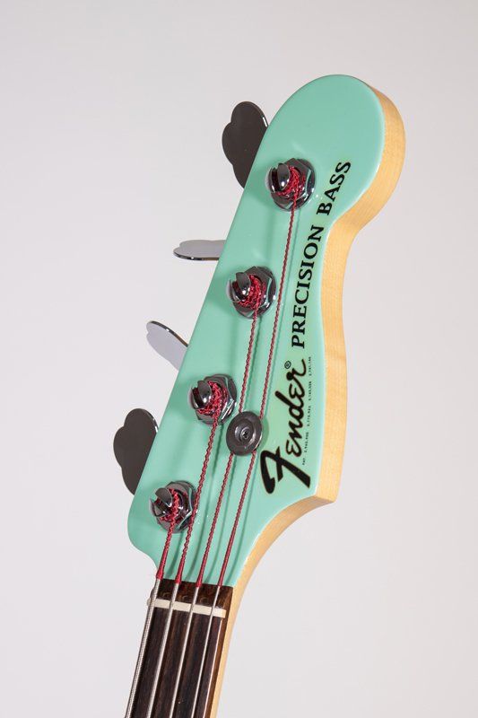 The headstock of a fender precision bass guitar