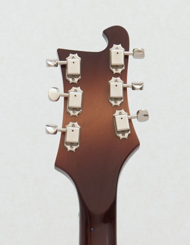 A close up of the headstock of a guitar