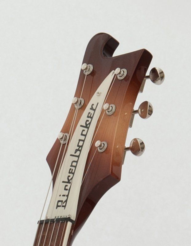 A close up of a rickenbacker guitar headstock