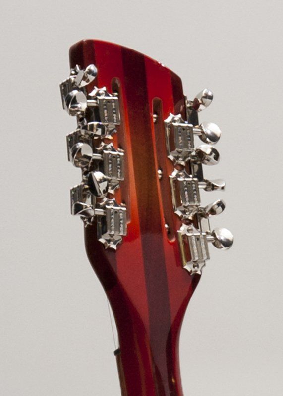 A close up of the headstock of a guitar