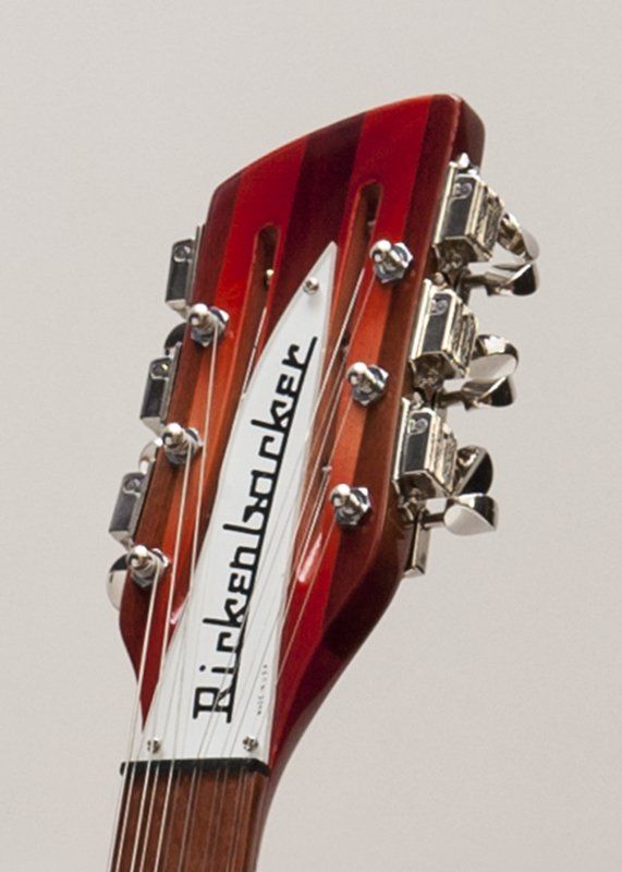 A close up of a rickenbacker guitar headstock