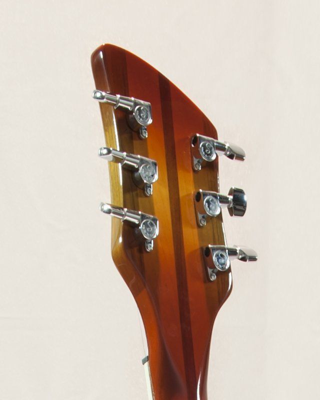 A close up of the headstock of a guitar