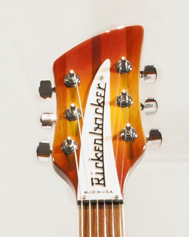 A close up of a rickenbacker guitar headstock