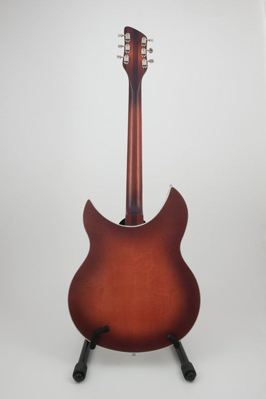 The back of a guitar is shown on a stand