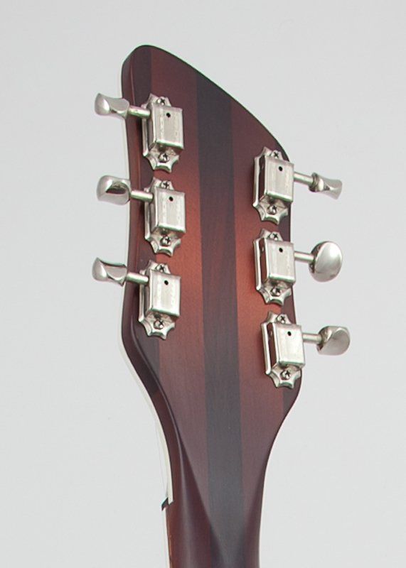 A close up of the headstock of a guitar
