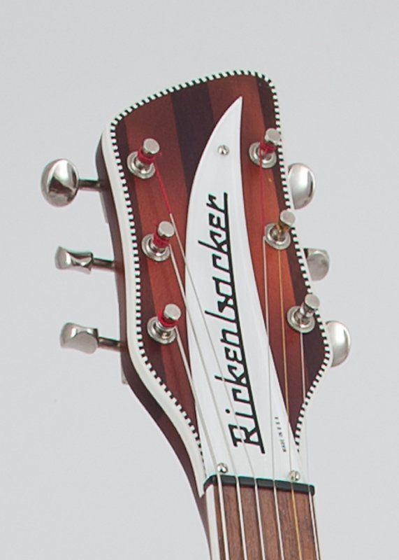 A close up of a rickenbacker guitar headstock