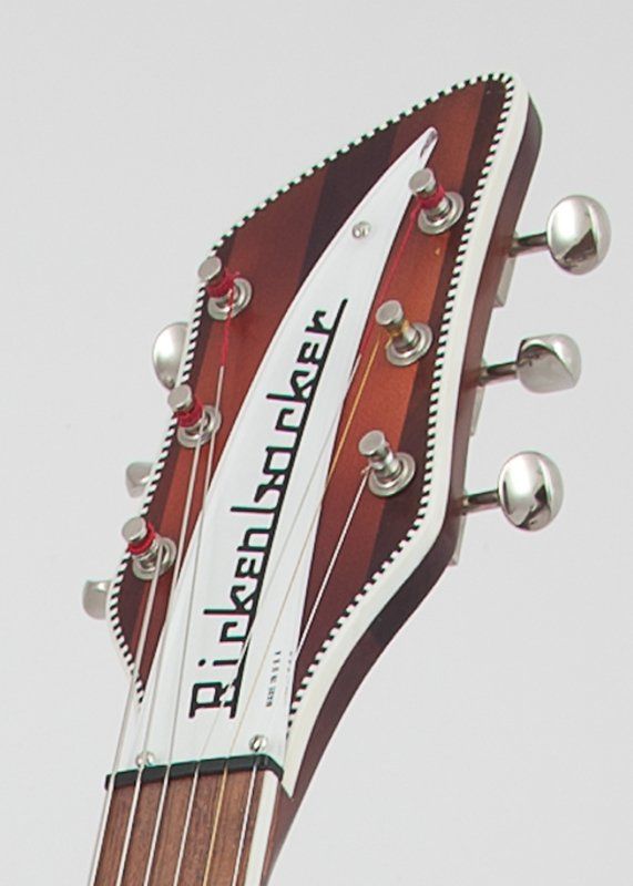 A close up of a rickenbacker guitar headstock