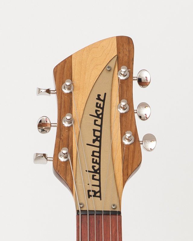 A close up of the headstock of a rickenbacker guitar