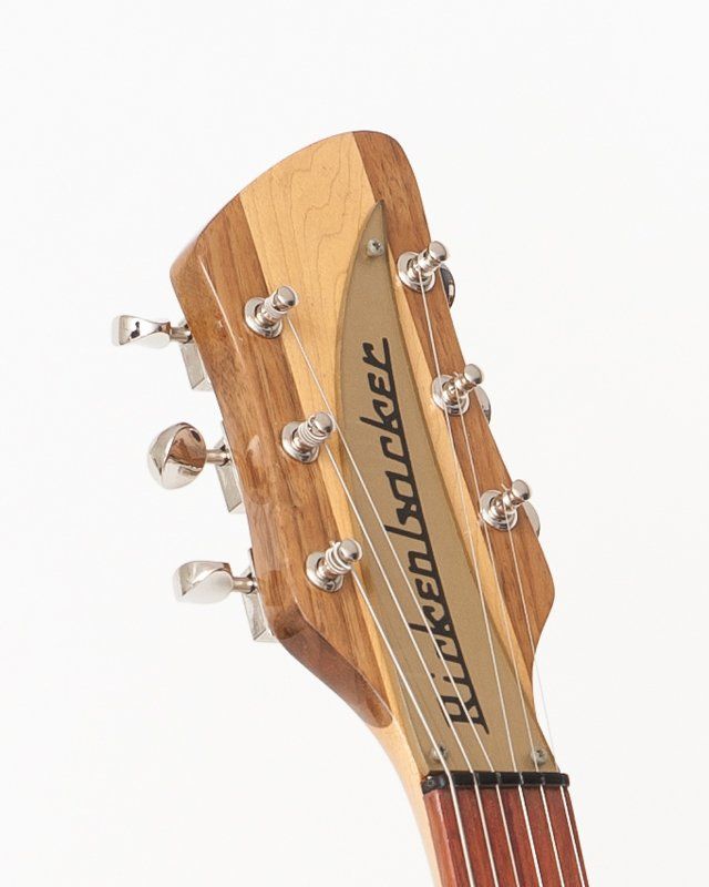 The headstock of a rickenbacker guitar is shown on a white background.