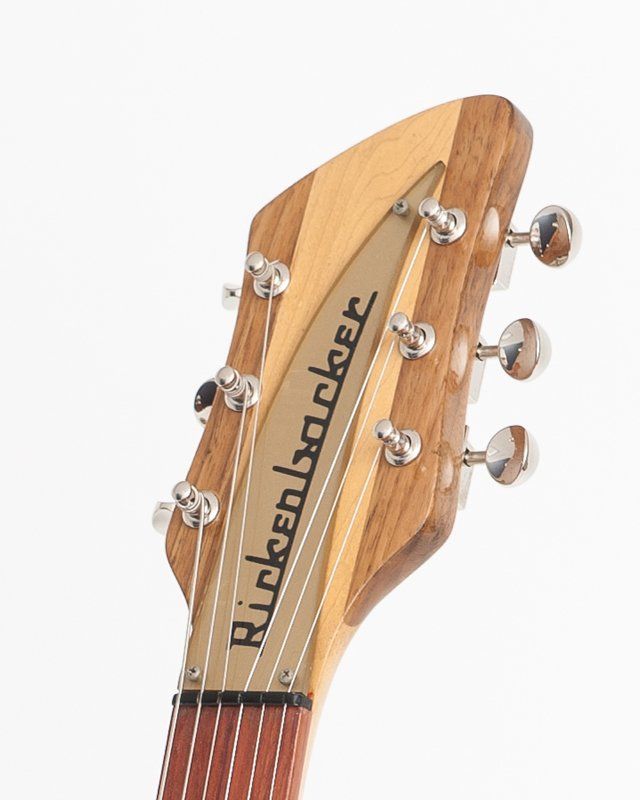 A close up of the headstock of a rickenbacker guitar