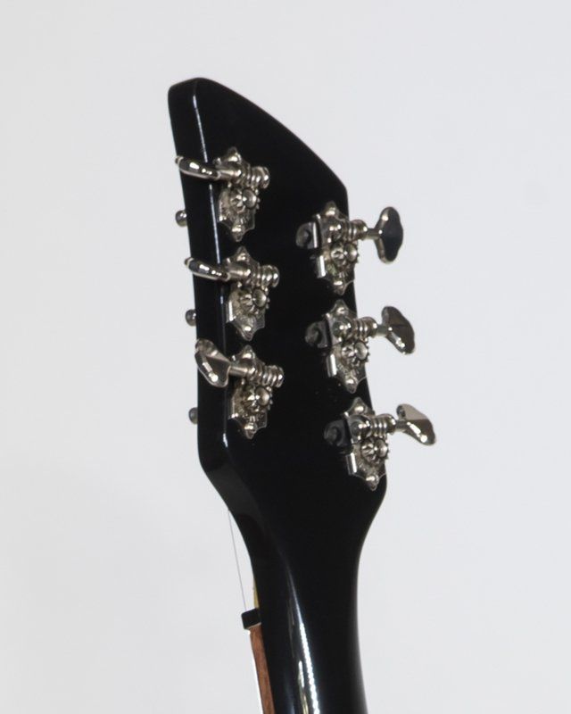 A close up of the headstock of a guitar