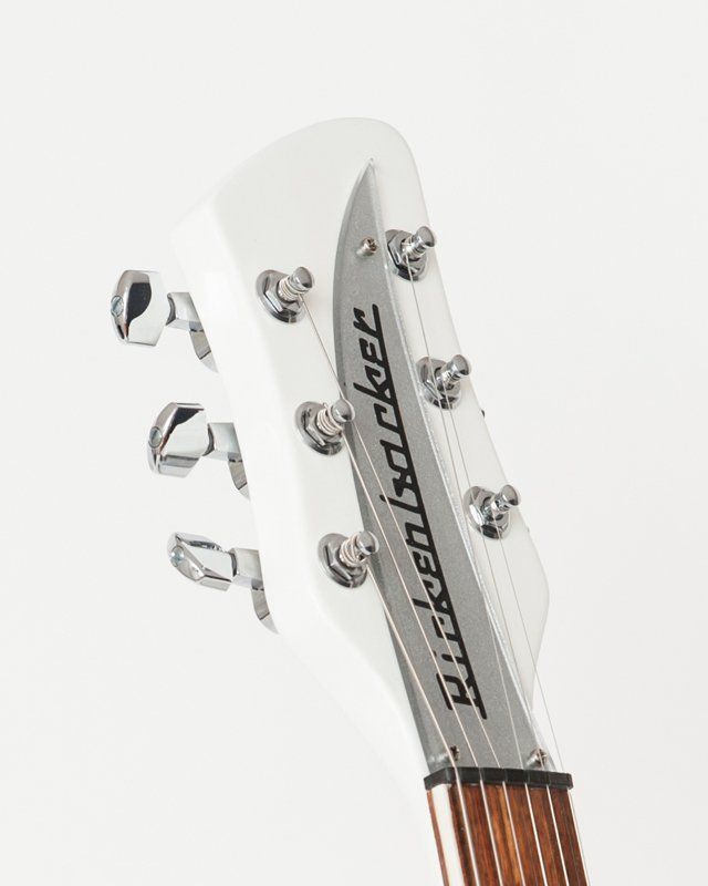 A close up of a rickenbacker guitar headstock