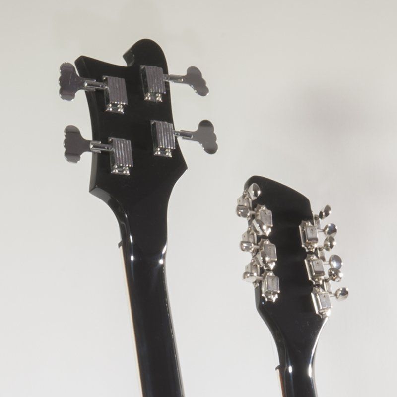 A close up of a guitar headstock and neck