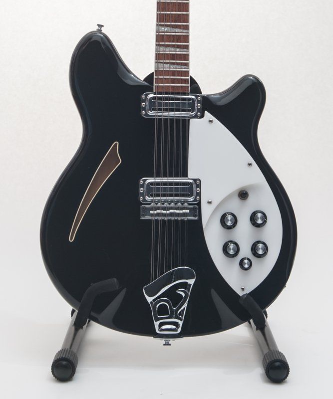 A black and white guitar with the number 80 on it
