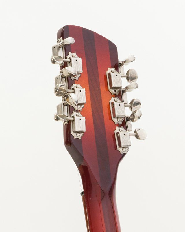 A close up of the headstock of a guitar