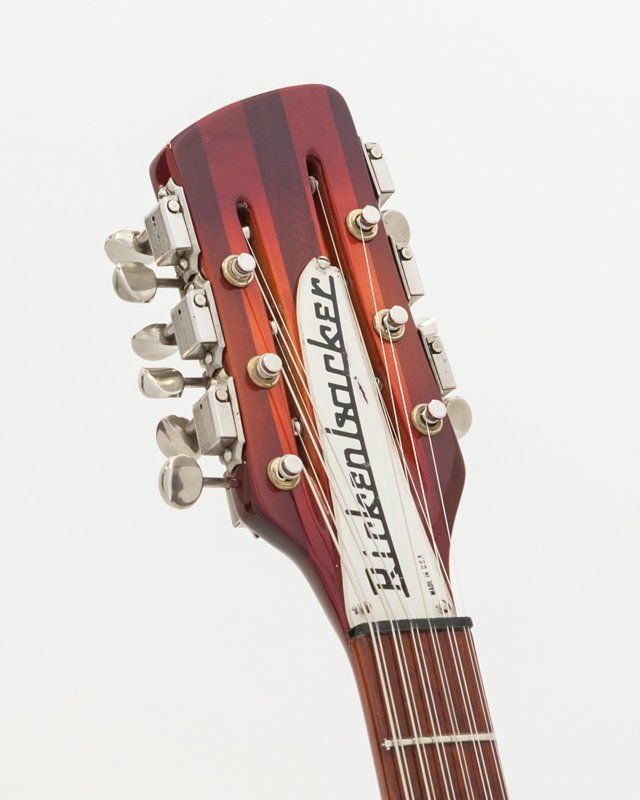 A close up of a rickenbacker guitar headstock