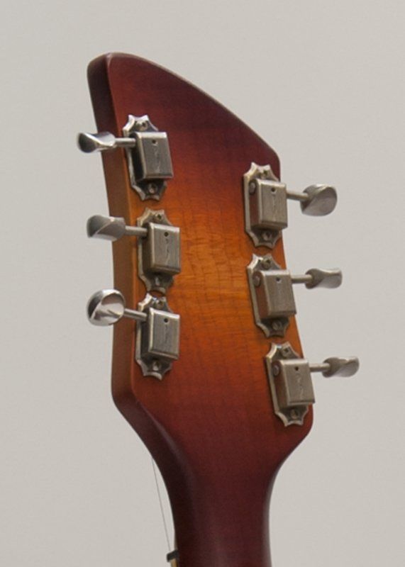 A close up of the headstock of a guitar