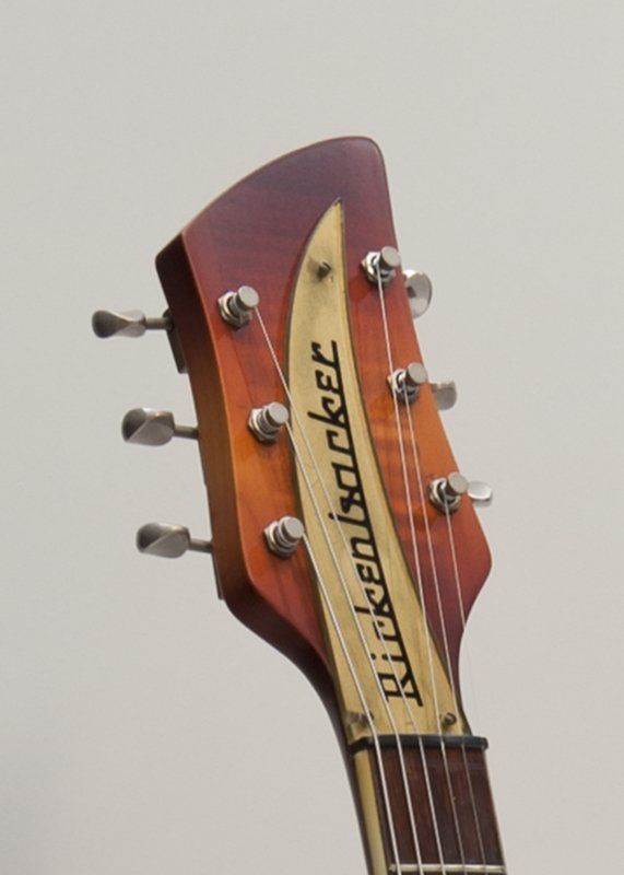 A close up of a rickenbacker guitar headstock