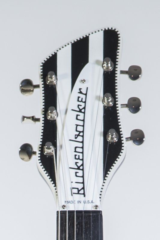 A black and white rickenbacker guitar headstock