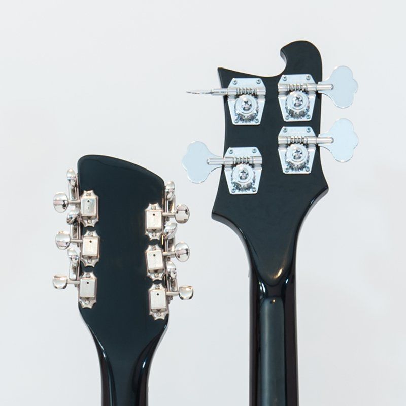 A close up of a guitar headstock and neck