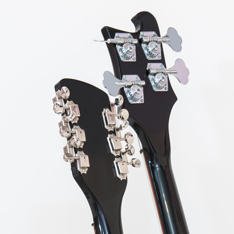 A close up of the back of a black guitar