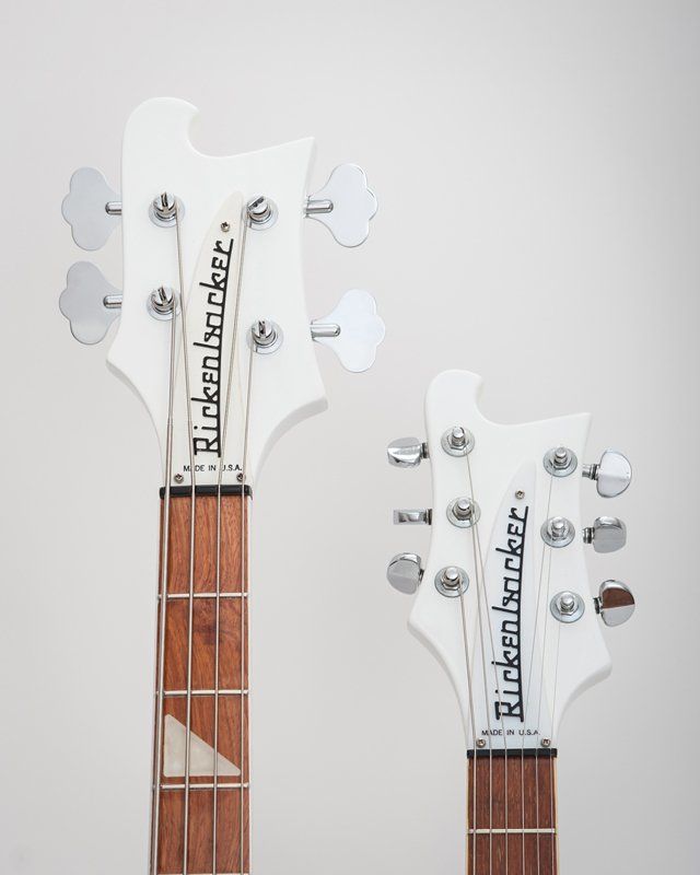 A white rickenbacker guitar and a white rickenbacker bass guitar