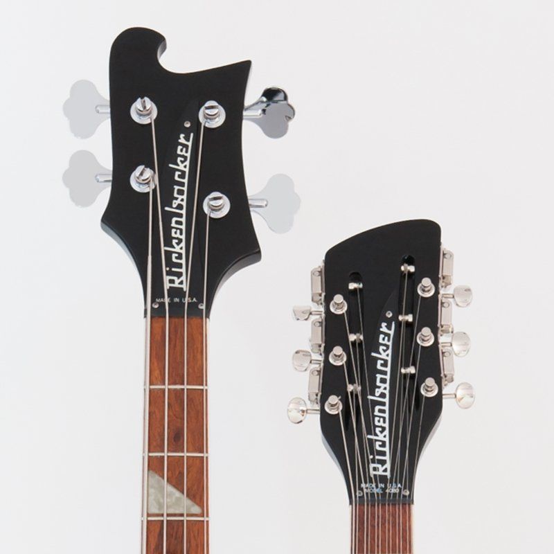 Two rickenbacker bass guitars on a white background