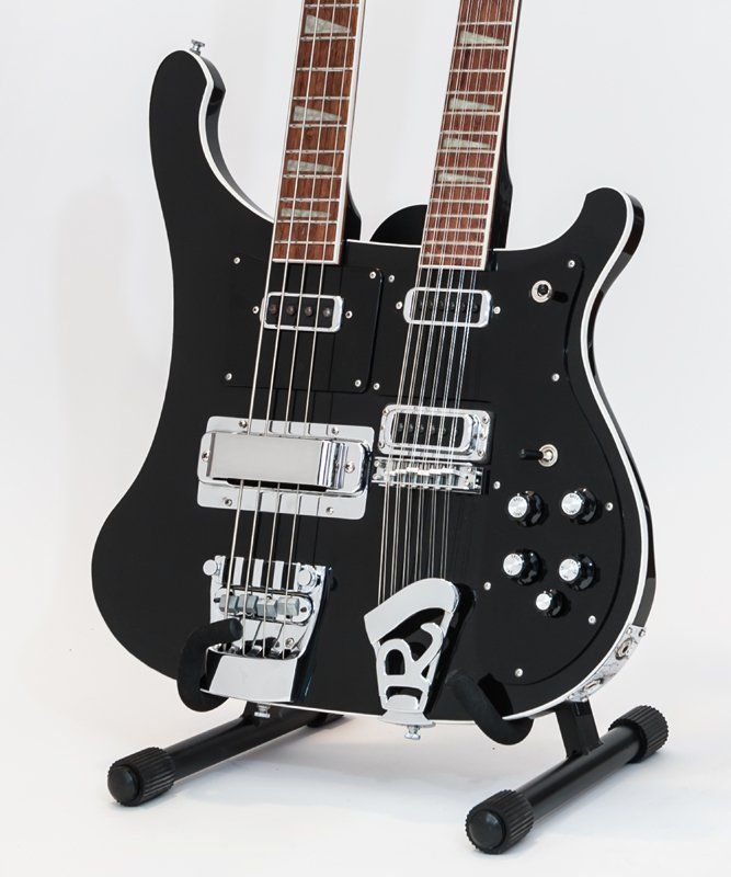 A black double neck guitar with the letter r on it