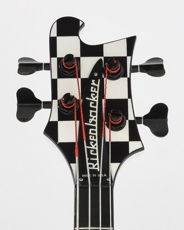 A black and white checkered headstock of a rickenbacker bass guitar
