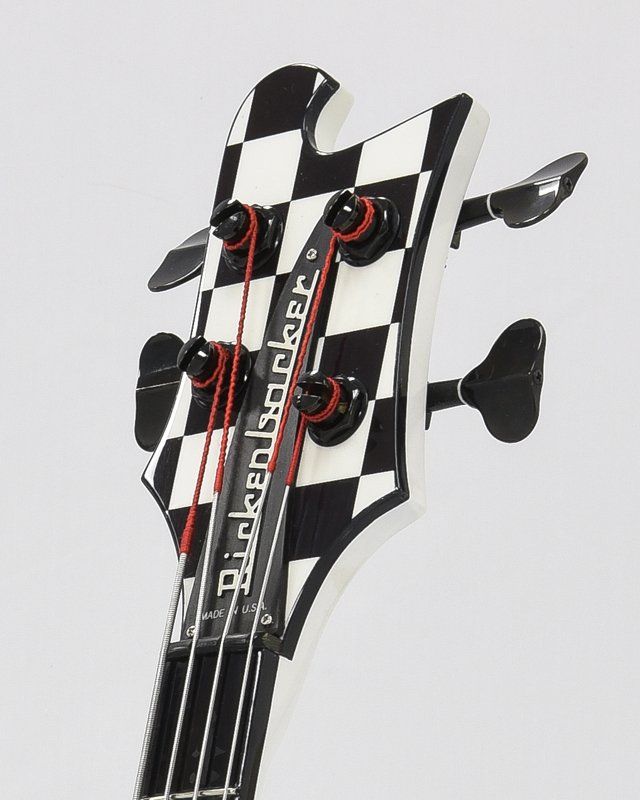 A black and white checkered bass guitar headstock