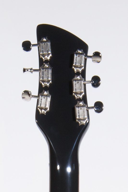 A close up of the headstock of a black guitar