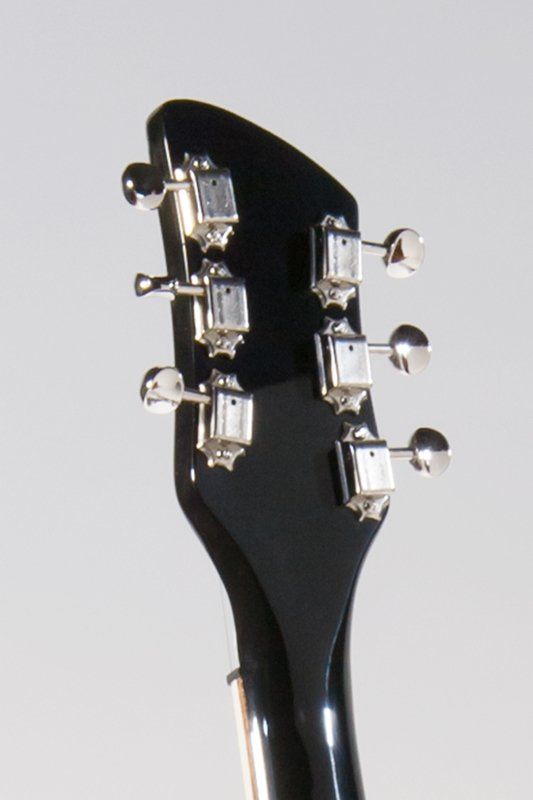 A close up of the headstock of an electric guitar