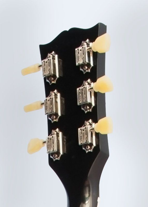 A close up of the headstock of a guitar