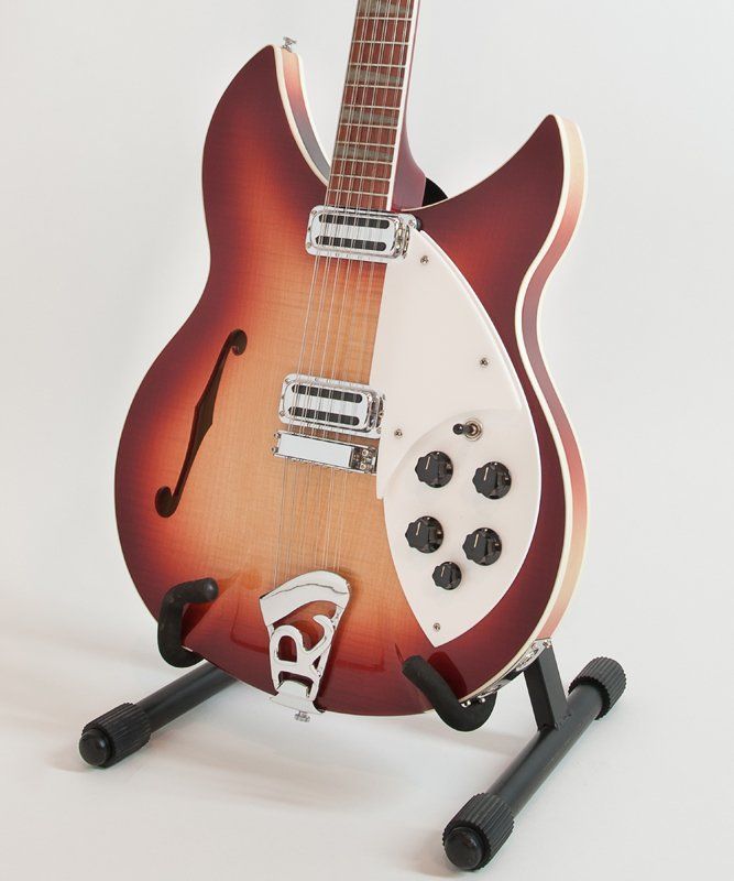 A guitar on a stand with the letter r on it