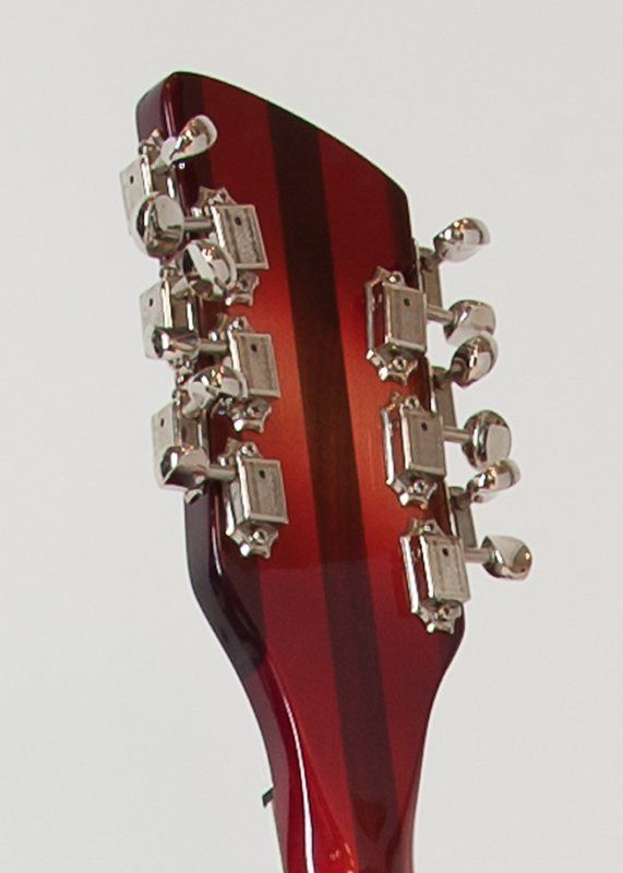 A close up of the headstock of a guitar