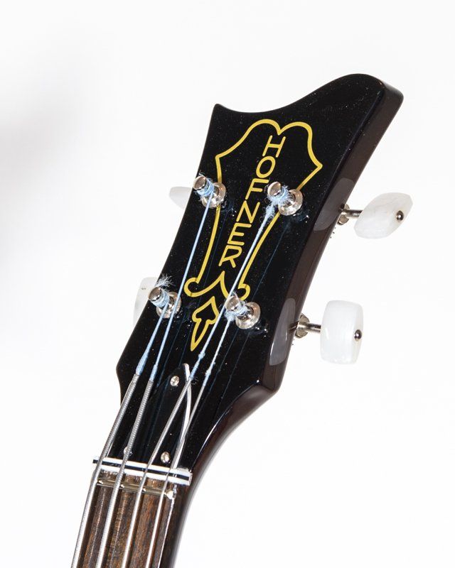 A close up of a guitar headstock that says zolzzur on it